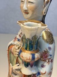 A Chinese famille rose candle holder in the shape of a court lady holding a 'Gu' vase, Qianlong