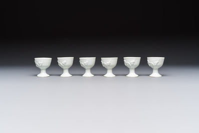 Four Chinese Dehua blanc de Chine figures of Guanyin and six wine cups, Kangxi and later