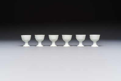 Four Chinese Dehua blanc de Chine figures of Guanyin and six wine cups, Kangxi and later