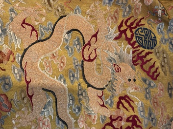 A Chinese imperial yellow-ground embroidered silk 'Nine Symbols' lady's 'Dragon' robe, 'Ji Fu' 吉服, 19th C.