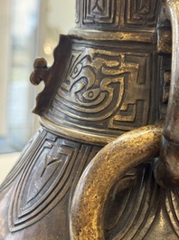 A fine and large Chinese archaistic gilt-bronze vase with handles, Ming
