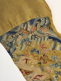 A Chinese imperial yellow-ground embroidered silk 'Nine Symbols' lady's 'Dragon' robe, 'Ji Fu' 吉服, 19th C.