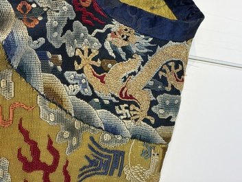 A Chinese imperial yellow-ground embroidered silk 'Nine Symbols' lady's 'Dragon' robe, 'Ji Fu' 吉服, 19th C.