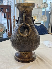 A fine and large Chinese archaistic gilt-bronze vase with handles, Ming