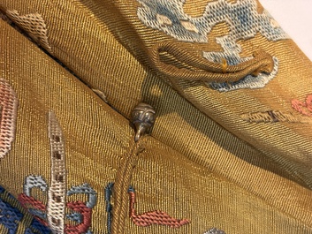 A Chinese imperial yellow-ground embroidered silk 'Nine Symbols' lady's 'Dragon' robe, 'Ji Fu' 吉服, 19th C.