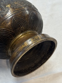 A fine and large Chinese archaistic gilt-bronze vase with handles, Ming