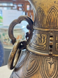 A fine and large Chinese archaistic gilt-bronze vase with handles, Ming