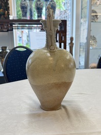 A Chinese straw-glazed pottery amphora with double dragon-shaped handles, Tang