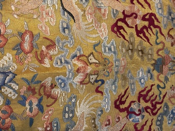 A Chinese imperial yellow-ground embroidered silk 'Nine Symbols' lady's 'Dragon' robe, 'Ji Fu' 吉服, 19th C.