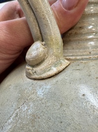 A Chinese straw-glazed pottery amphora with double dragon-shaped handles, Tang