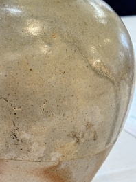 A Chinese straw-glazed pottery amphora with double dragon-shaped handles, Tang