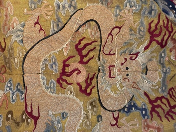 A Chinese imperial yellow-ground embroidered silk 'Nine Symbols' lady's 'Dragon' robe, 'Ji Fu' 吉服, 19th C.