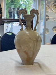 A Chinese straw-glazed pottery amphora with double dragon-shaped handles, Tang