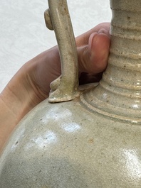 A Chinese straw-glazed pottery amphora with double dragon-shaped handles, Tang