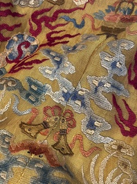 A Chinese imperial yellow-ground embroidered silk 'Nine Symbols' lady's 'Dragon' robe, 'Ji Fu' 吉服, 19th C.