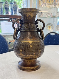 A fine and large Chinese archaistic gilt-bronze vase with handles, Ming