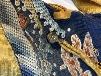 A Chinese imperial yellow-ground embroidered silk 'Nine Symbols' lady's 'Dragon' robe, 'Ji Fu' 吉服, 19th C.