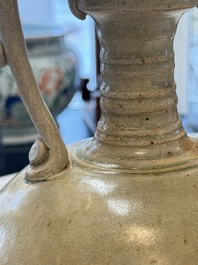 A Chinese straw-glazed pottery amphora with double dragon-shaped handles, Tang