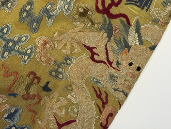 A Chinese imperial yellow-ground embroidered silk 'Nine Symbols' lady's 'Dragon' robe, 'Ji Fu' 吉服, 19th C.