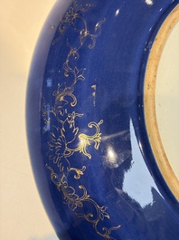 A large Chinese gilt-decorated powder-blue-ground 'Dragon' dish on a later wooden stand, Guangxu mark and of the period