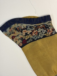 A Chinese imperial yellow-ground embroidered silk 'Nine Symbols' lady's 'Dragon' robe, 'Ji Fu' 吉服, 19th C.