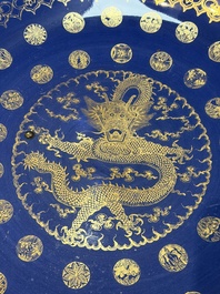 A large Chinese gilt-decorated powder-blue-ground 'Dragon' dish on a later wooden stand, Guangxu mark and of the period