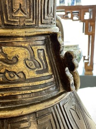 A fine and large Chinese archaistic gilt-bronze vase with handles, Ming