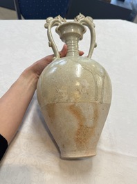 A Chinese straw-glazed pottery amphora with double dragon-shaped handles, Tang