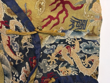 A Chinese imperial yellow-ground embroidered silk 'Nine Symbols' lady's 'Dragon' robe, 'Ji Fu' 吉服, 19th C.
