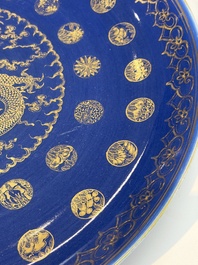 A large Chinese gilt-decorated powder-blue-ground 'Dragon' dish on a later wooden stand, Guangxu mark and of the period