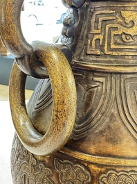A fine and large Chinese archaistic gilt-bronze vase with handles, Ming