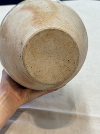 A Chinese straw-glazed pottery amphora with double dragon-shaped handles, Tang