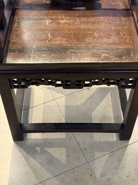 A Chinese carved hongmu armchair, 19th C.