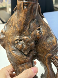 A group of 11 Chinese carved bamboo and wooden works, 19/20th C.