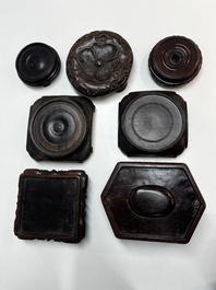 A collection of 25 Chinese wooden stands, 19/20th C.