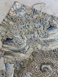 A Chinese cream-ground embroidered silk panel with bats, floral scrolls, waves and rockwork, 19th C.