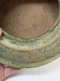 A Chinese green-glazed pottery ritual tripod food vessel with handles, 'Ding 鼎', Han