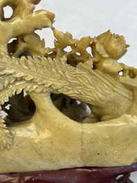A fine Chinese carved soapstone 'Squirrels and Grapes' group and a 'Phoenixes among Peonies' group, 20th C.