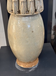 A large Chinese qingbai covered urn applied with immortals and a dragon, Northern Song