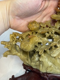A fine Chinese carved soapstone 'Squirrels and Grapes' group and a 'Phoenixes among Peonies' group, 20th C.