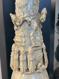 A large Chinese qingbai covered urn applied with immortals and a dragon, Northern Song