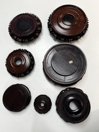A collection of 20 Chinese wooden stands, 19/20th C.