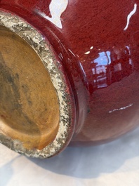 A Chinese flamb&eacute;-glazed vase and a jar with wooden cover, 19th C.