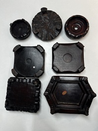 A collection of 25 Chinese wooden stands, 19/20th C.