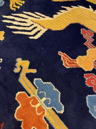 A Sino-Tibetan inscribed woollen 'Dragon' pillar carpet, 19th C.