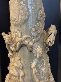 A large Chinese qingbai covered urn applied with immortals and a dragon, Northern Song