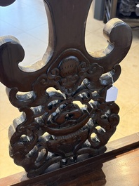 A Chinese carved hongmu armchair, 19th C.