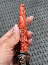 Three Chinese red coral carvings on wooden stands, 19/20th C.