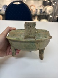 A Chinese green-glazed pottery ritual tripod food vessel with handles, 'Ding 鼎', Han