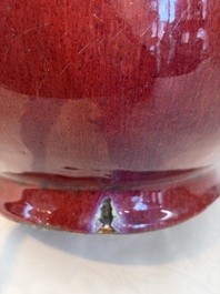A Chinese flamb&eacute;-glazed vase and a jar with wooden cover, 19th C.